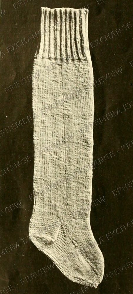 Vintage 1919 knitting photograph: knit stocking on black